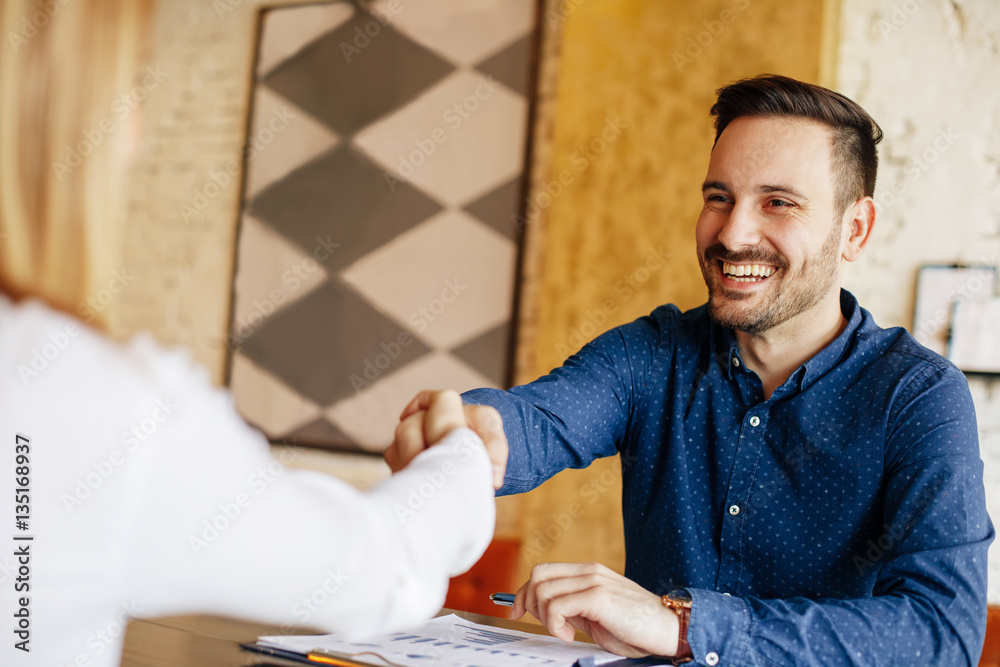 Fototapeta premium Businessman and businesswoman handshake