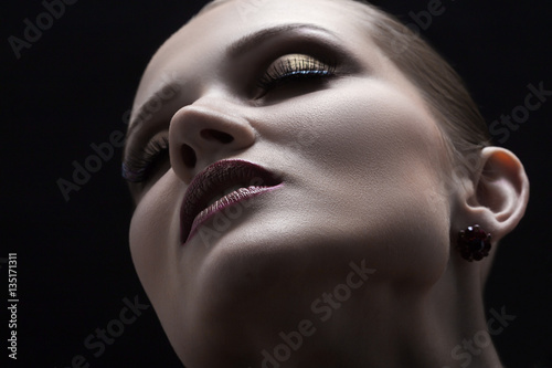 happy luxury woman model with professional makeup on black background