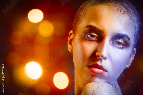 happy luxury woman model with professional makeup on glossy background