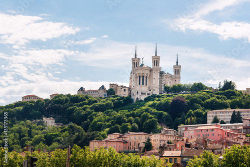 Colorful houses of Lyon and Fourviere Basilica from the Saone riverbank, France