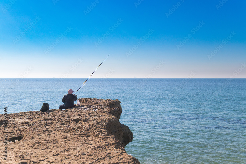 Old person fishing