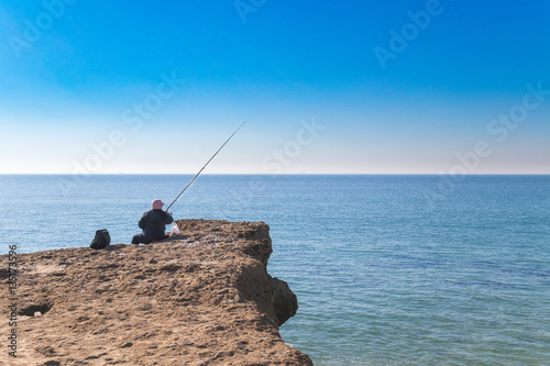 Old person fishing