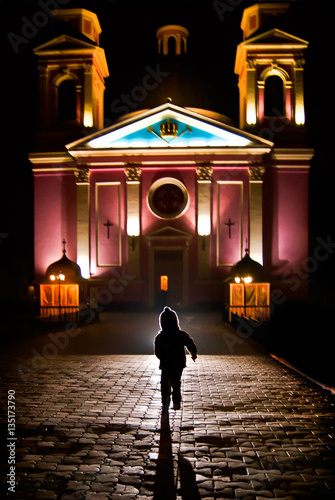 Child silhouette that runs into the church