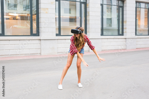 Young Beautiful Woman Using VR Outside