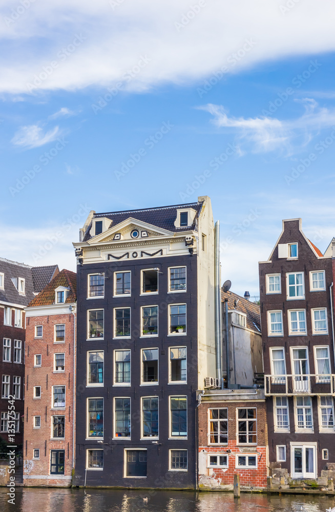 Traditional houses at the Damrak in Amsterdam