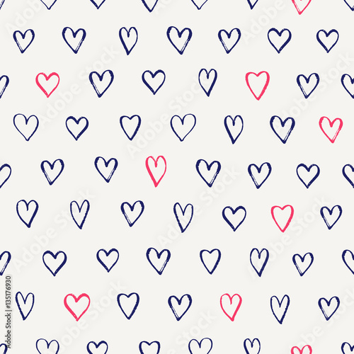 Seamless pattern with hand drawn hearts in blue and pink on cream background.