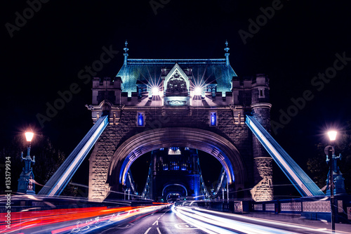 Fototapeta Naklejka Na Ścianę i Meble -  Tower Bridge in London at night with car traffic light trails