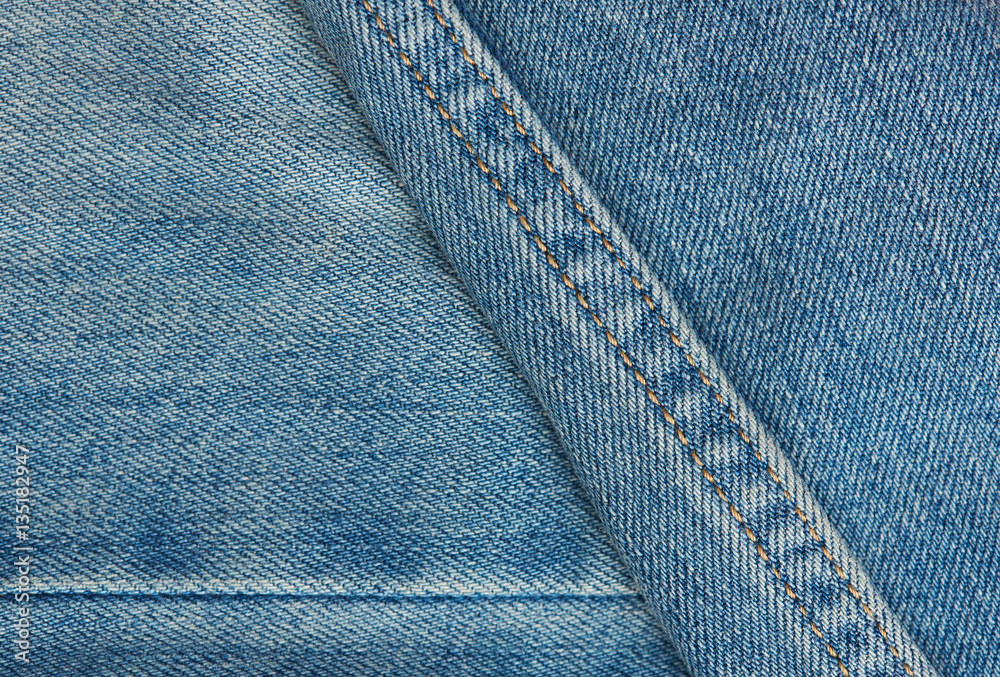 Fototapeta premium Blue jeans surface with stiches