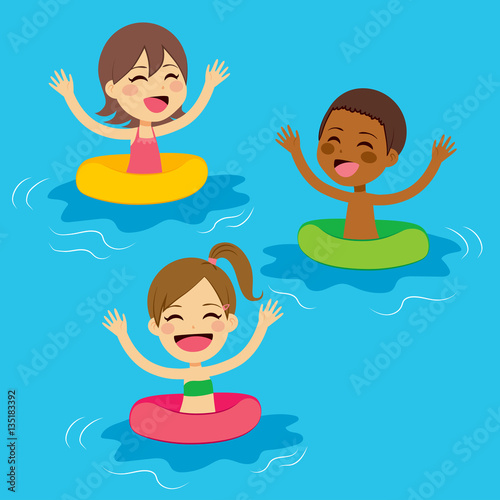 Three cute little kids swimming with colorful floats