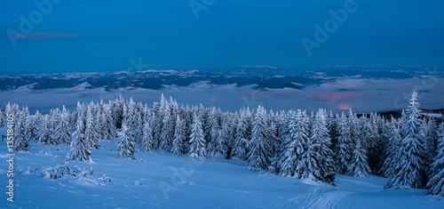 Landscape in the night. View over small mountain city at night in winter.   © krstrbrt