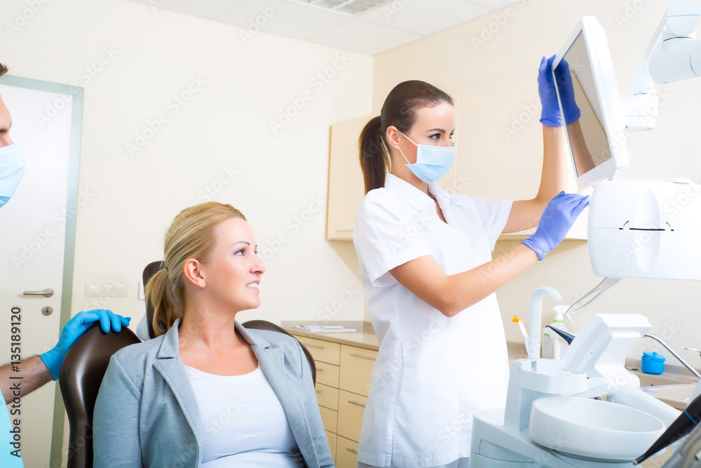 Adult woman getting her checkup at the Dentist Adult woman getting her checkup at the Dentist