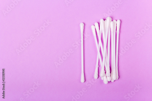 closeup clean ear sticks on violet background slide