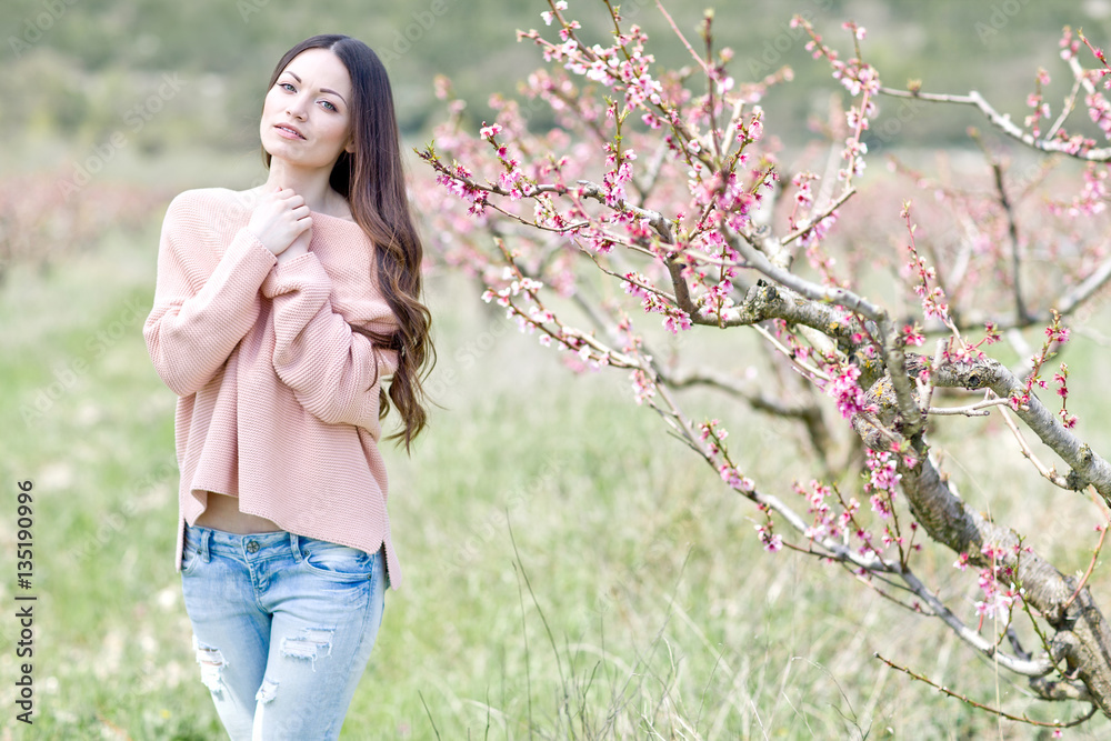 Beautiful woman in a spring garden 