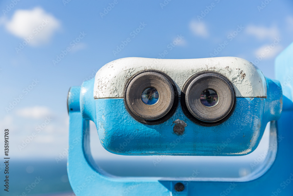 Coin operated binocular viewer with blue sky