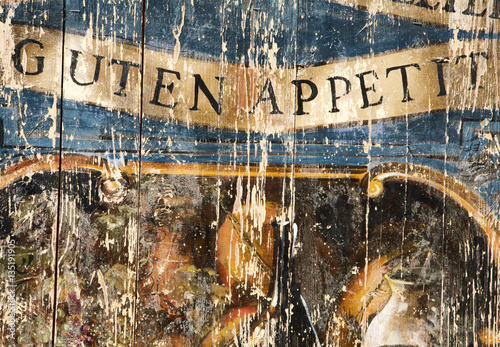 Guten Appetit words on old wooden door photo