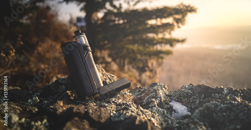 Photos close-up of the vaporizer in the mountains in a landscape