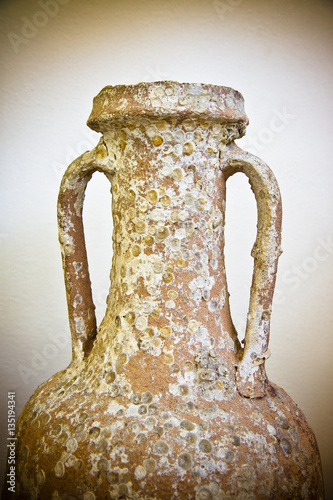 Fotografie Detail of an old roman amphora - toned image (Italy)