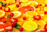 beautiful fresh sliced mixed citrus fruits as background with di
