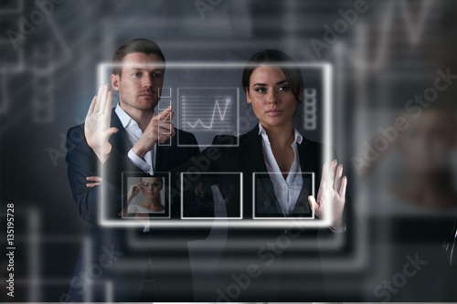 Business people working with virtual display photo