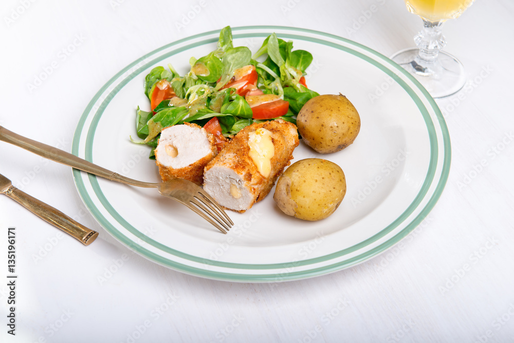 Kiev cutlet with jacket potatoes and salad Kiev cutlet with jacket potatoes and salad