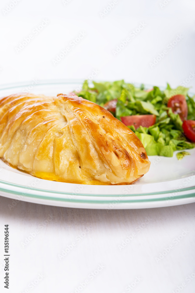 Chicken breast in french pastry with fresh salad Chicken breast in french pastry with fresh salad