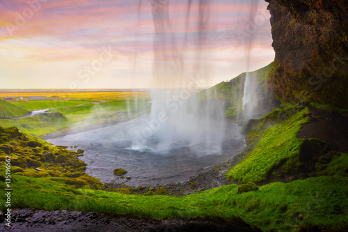 Colorful evening view from the middle of famous Seljalandfoss Wa