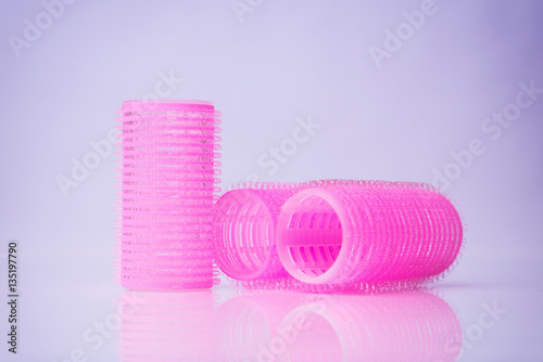 Hair curlers on white background