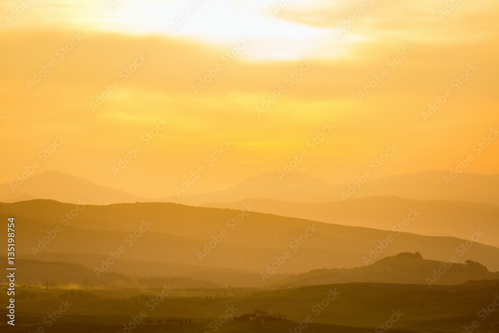 Rolling rural landscape at sunset