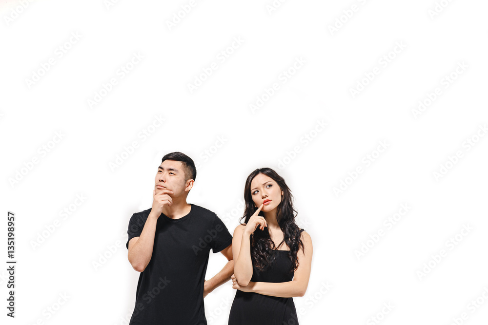 Portrait of pensive Korean couple isolated on white Portrait of pensive Korean couple isolated on white