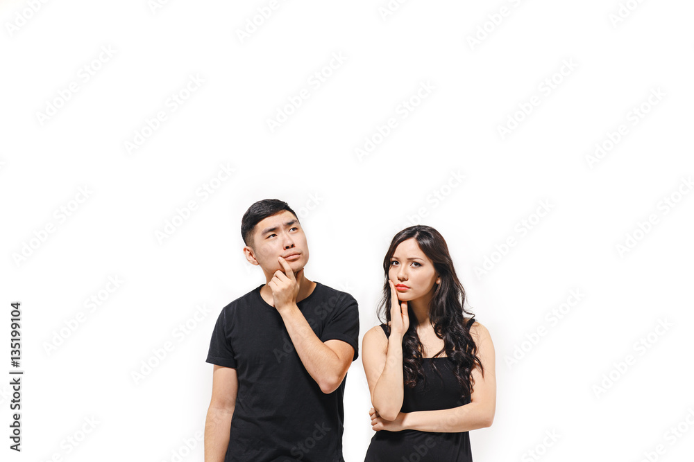 Portrait of pensive Korean couple isolated on white Portrait of pensive Korean couple isolated on white