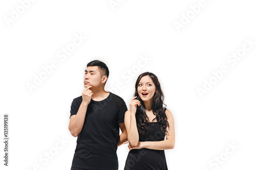 Portrait of pensive Korean couple isolated on white