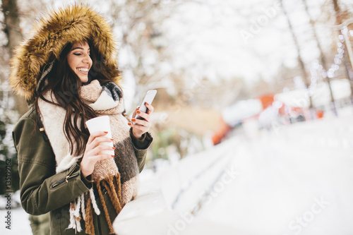Young woman using a phone a...