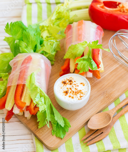 Spring roll with vegetables and white sour cream souce photo