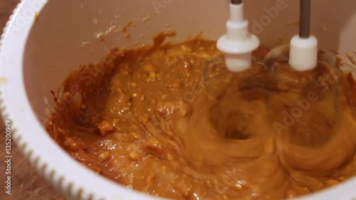 Mixing cream for cake filling in a blender close up. photo