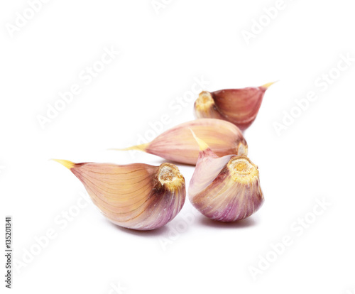 Fresh garlic cloves isolated on white background