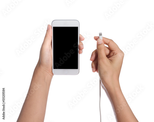 smart phone with blank screen and charger in hand isolated