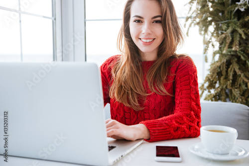 Free Download Attractive young lady sitting in cafe - GFXLoad