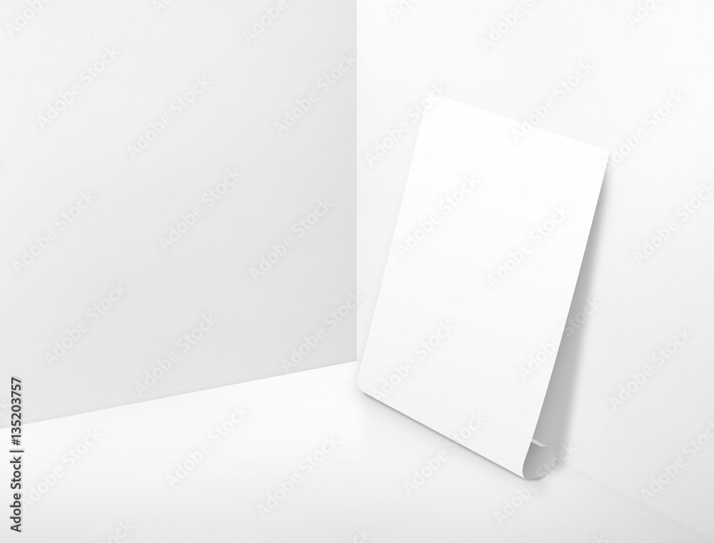 Naklejka premium Blank white rolling poster at corner painted white color studio