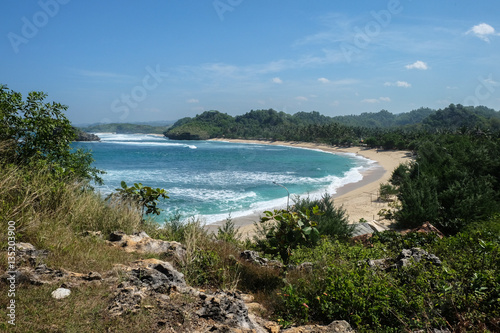 tropical bay with white sand at wediombo  java island  indonesia