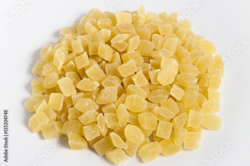 dehydrated pineapple core dice on white background