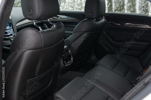 Rear leather seats in the luxury car. © vpilkauskas