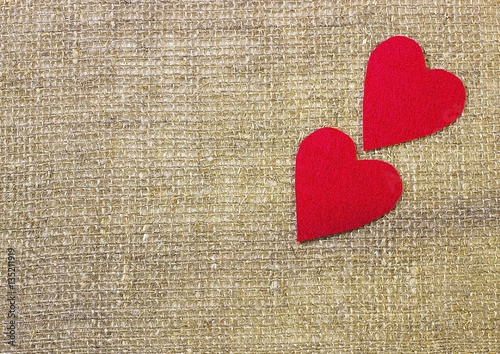 A two decorative red hearts on gray background