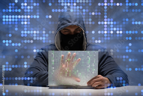 Cuadro en lienzo Young hacker in data security concept
