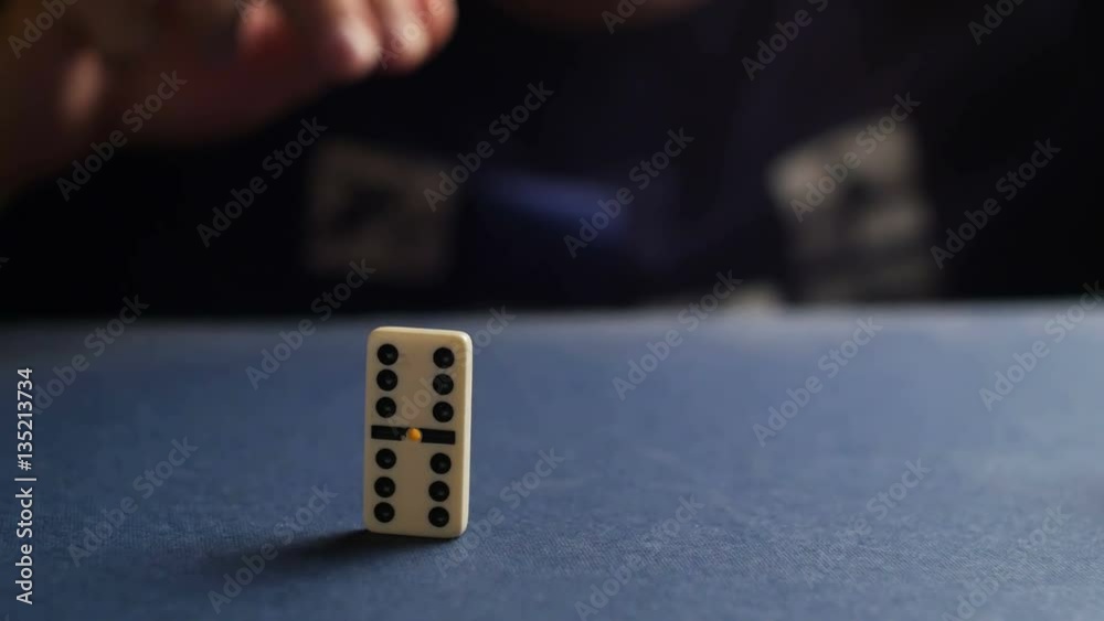 Man set up the domino with hand. Domino effect Man set up the domino with hand. Domino effect