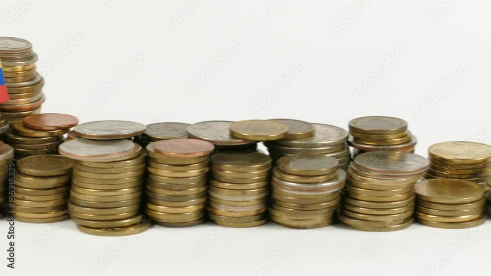 Colombia flag waving with stack of money coins Colombia flag waving with stack of money coins