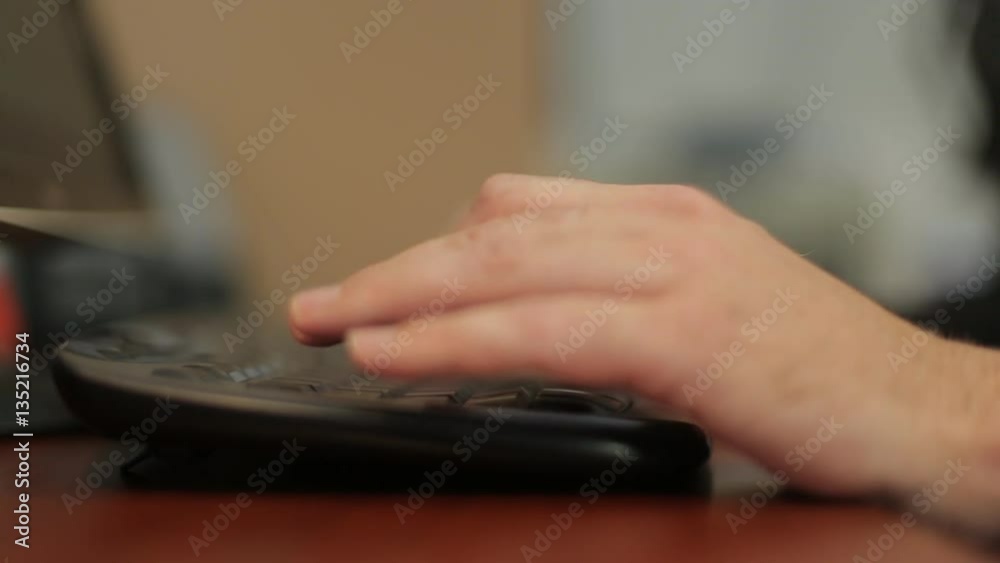 Men's hands typing on a keyboard Men's hands typing on a keyboard