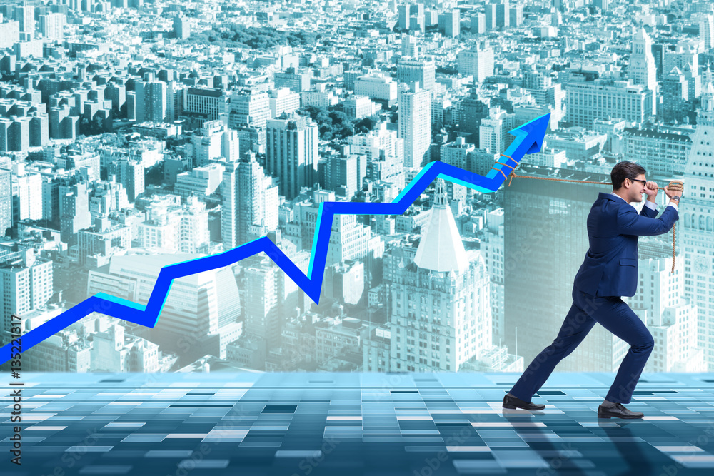 Businessman supporting increase in economy Businessman supporting increase in economy