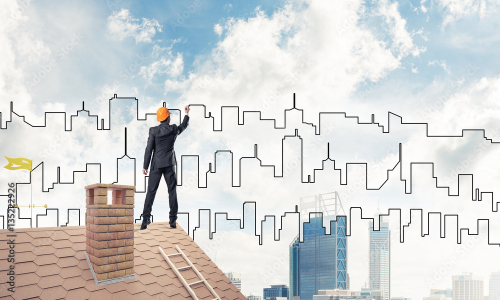 Man architect draw silhouette of modern city on blue sky. Mixed Man architect draw silhouette of modern city on blue sky. Mixed