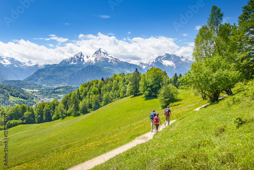 Hikers on the way down to Berchtesgaden, Snowy Watzmann in the b