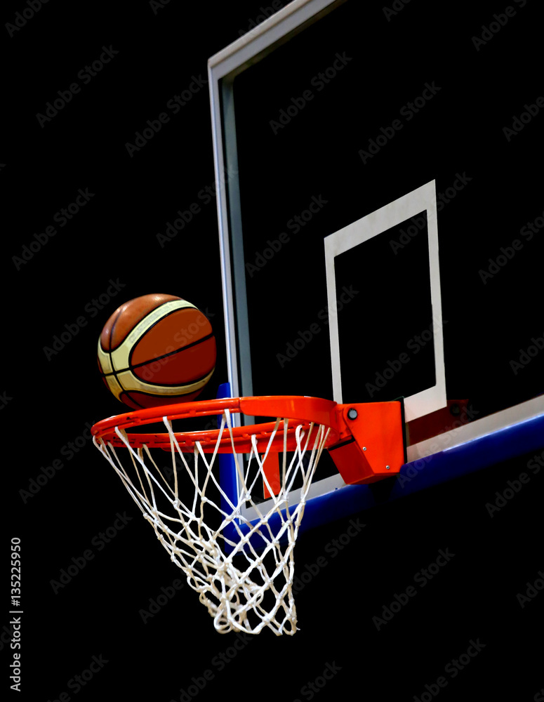 basketball enter the basket during a basketball match